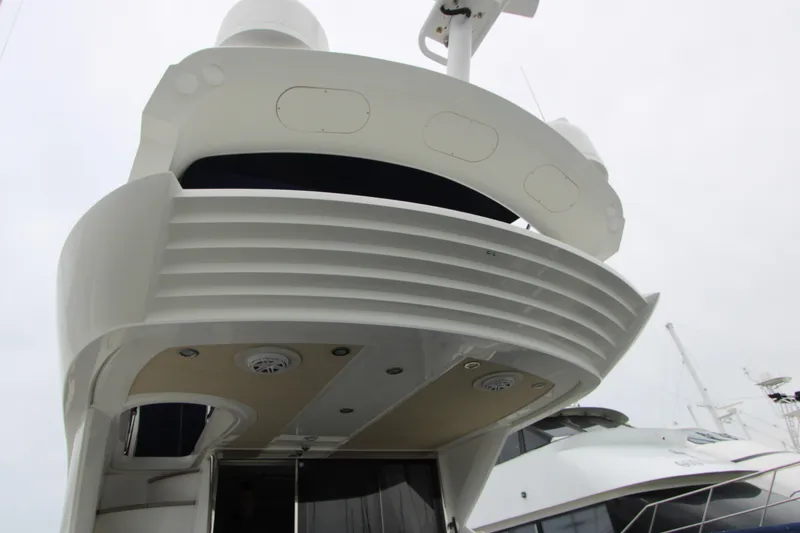 Slide: The Image of Sunseeker Manhattan 55 yacht, 2014 model, showcasing sleek design and modern architecture. - 8