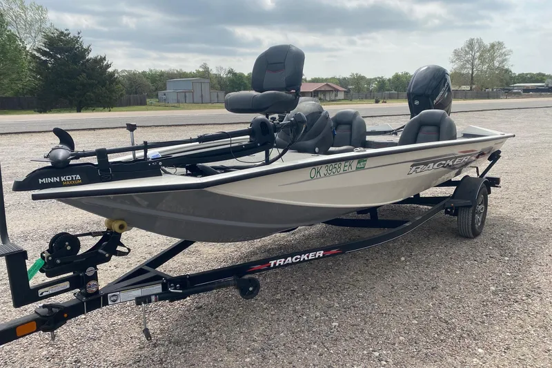Slide: The Image of 2023 Tracker Pro Team 175 TF fishing boat on trailer, equipped with Minn Kota motor. - 3