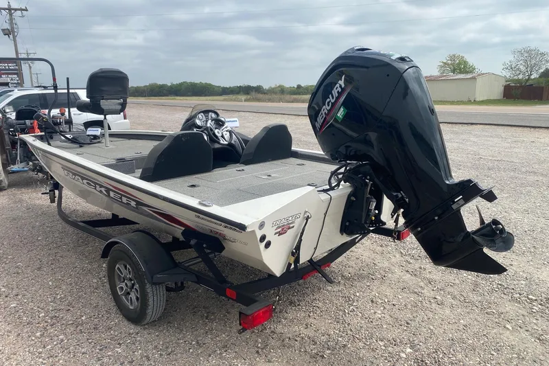 Slide: The Image of 2023 Tracker Pro Team 175 TF boat with Mercury outboard motor on a trailer. - 4