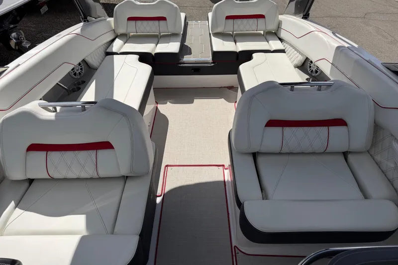 Slide: The Image of Luxurious interior of 2021 Regal LS6 boat with white and red seating. - 15
