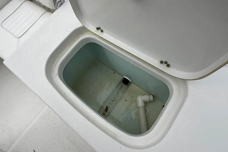 Slide: The Image of Open storage compartment on 2016 Sea Hunt BX 22 BR boat. - 12