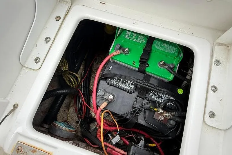 Slide: The Image of Battery compartment of a 2016 Sea Hunt BX 22 BR boat with wiring. - 14