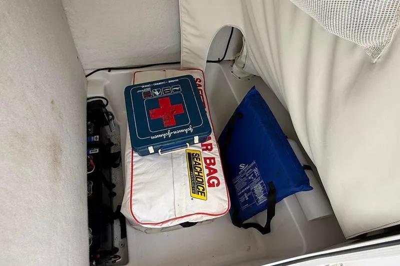 Slide: The Image of Storage compartment in a 2016 Sea Hunt BX 22 BR boat with safety gear. - 26
