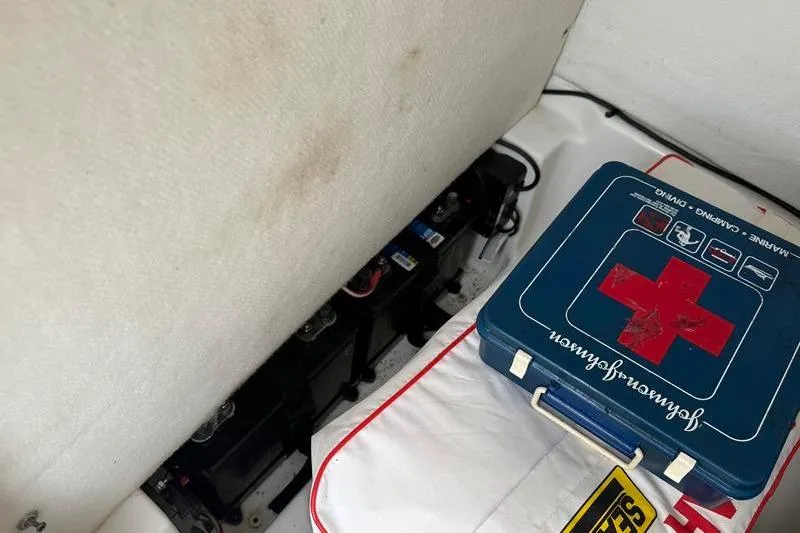 Slide: The Image of First aid kit and battery compartment in 2016 Sea Hunt BX 22 BR boat. - 27