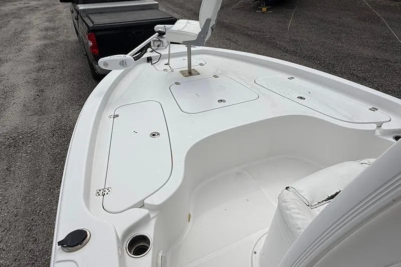 Slide: The Image of 2016 Sea Hunt BX 22 BR boat deck with seating and storage compartments. - 28
