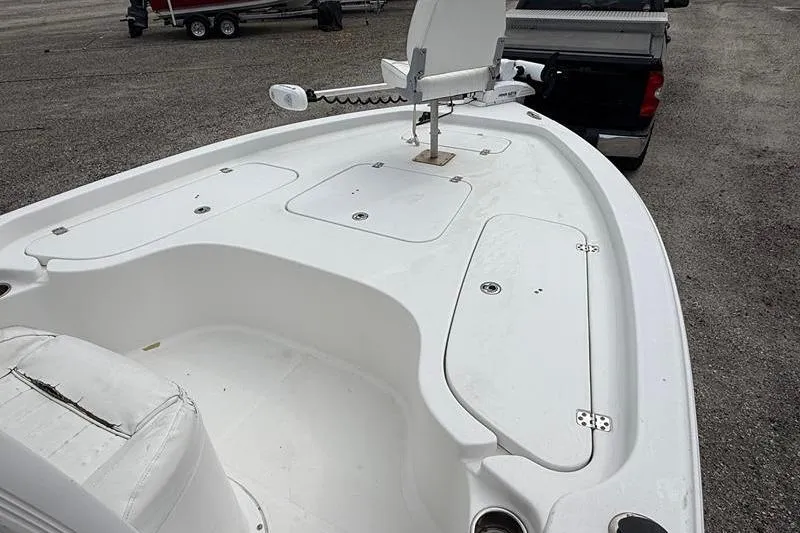 Slide: The Image of 2016 Sea Hunt BX 22 BR boat deck with storage compartments and trolling motor. - 29
