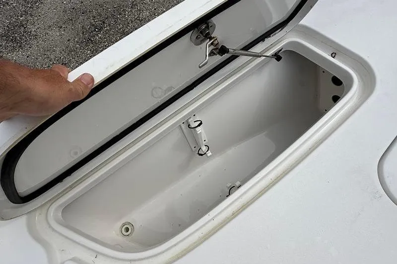 Slide: The Image of Open storage compartment on a 2016 Sea Hunt BX 22 BR boat. - 30