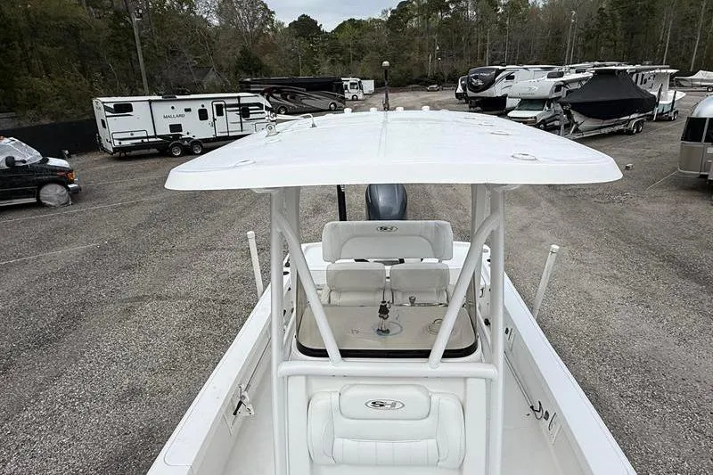 Slide: The Image of 2016 Sea Hunt BX 22 BR boat in a parking lot with RVs and trailers. - 36