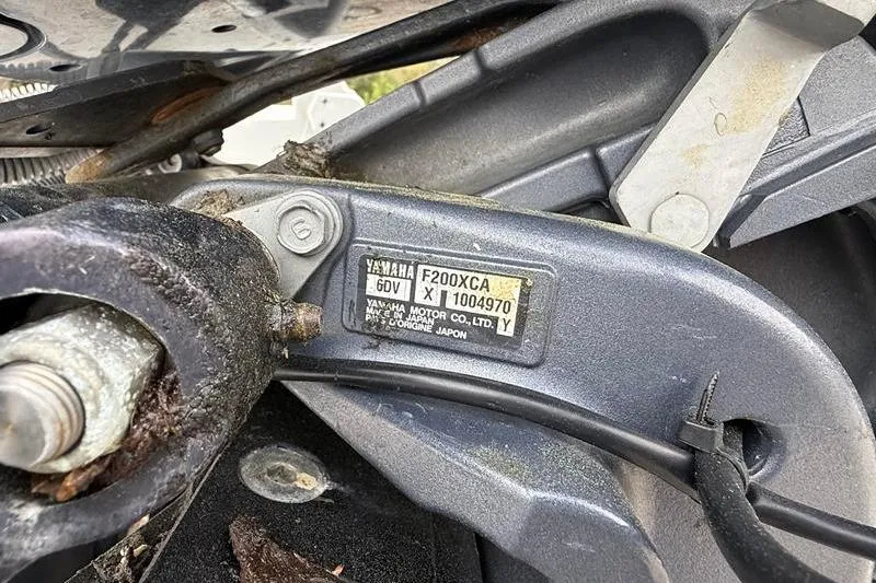 Slide: The Image of Close-up of a Yamaha F200XCA engine part on a 2016 Sea Hunt BX 22 BR boat. - 38
