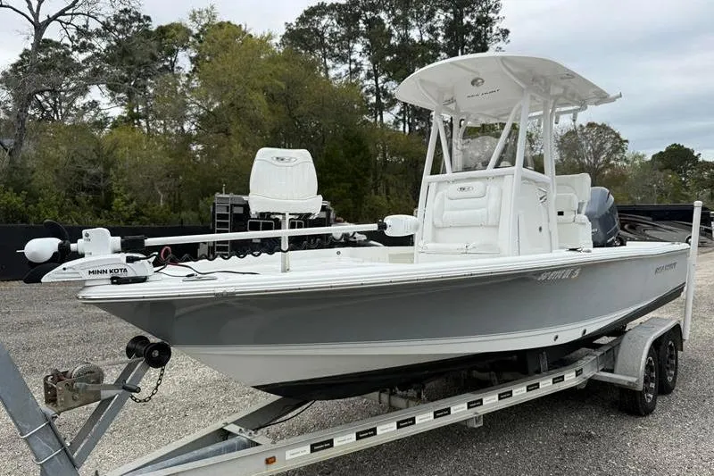 Slide: The Image of 2016 Sea Hunt BX 22 BR boat on trailer, featuring Minn Kota trolling motor. - 7
