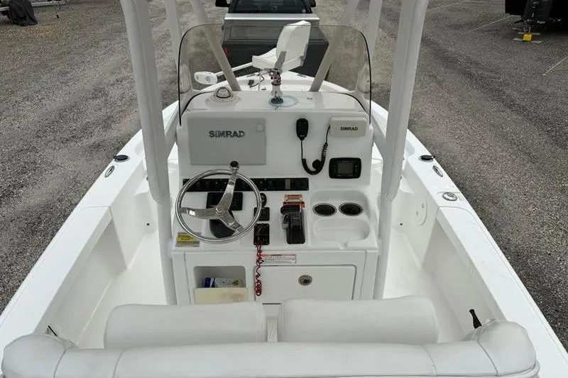 Slide: The Image of 2016 Sea Hunt BX 22 BR boat console with steering wheel and navigation equipment. - 8