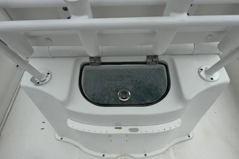 Slide: The Image of 2016 Sea Hunt BX 22 BR boat storage compartment with secure latch. - 9