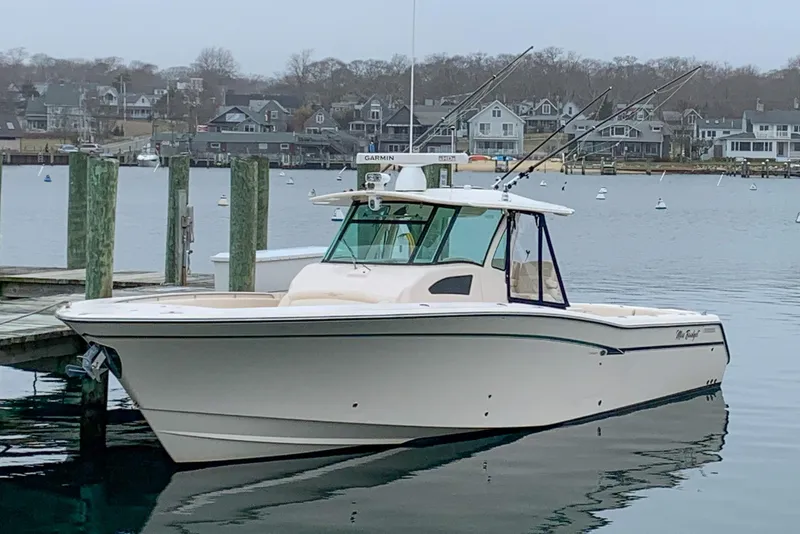 The Image of 2011 Grady-White Canyon 366 boat docked in a serene harbor setting. - 0