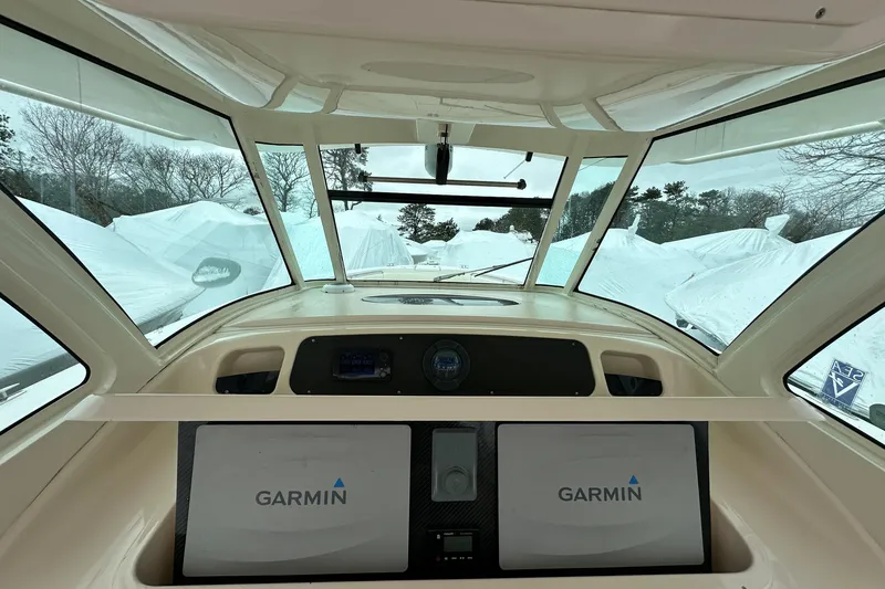 Slide: The Image of Interior view of 2011 Grady-White Canyon 366 boat with Garmin navigation system. - 10