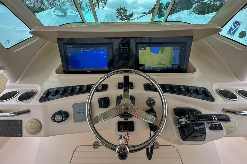 Slide: The Image of Helm of 2011 Grady-White Canyon 366 with dual Garmin displays and controls. - 11