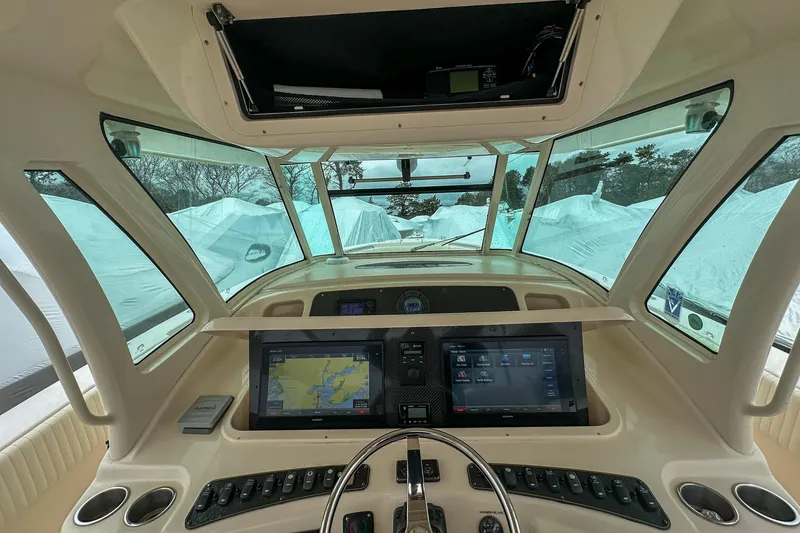 Slide: The Image of Helm of 2011 Grady-White Canyon 366 with advanced navigation displays and controls. - 15