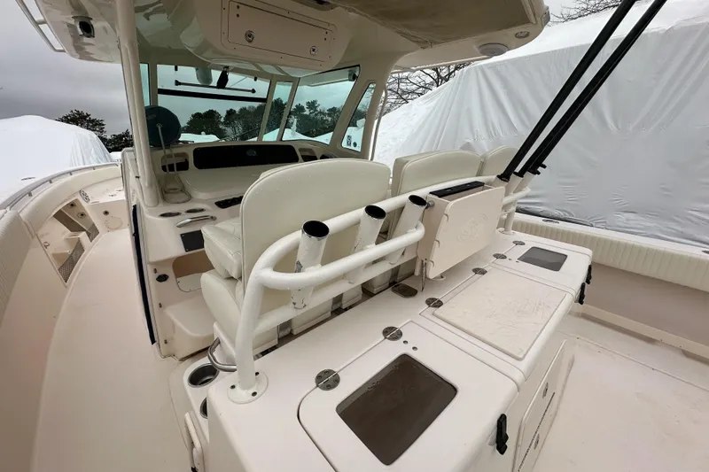 Slide: The Image of 2011 Grady-White Canyon 366 boat interior with helm and seating area. - 17