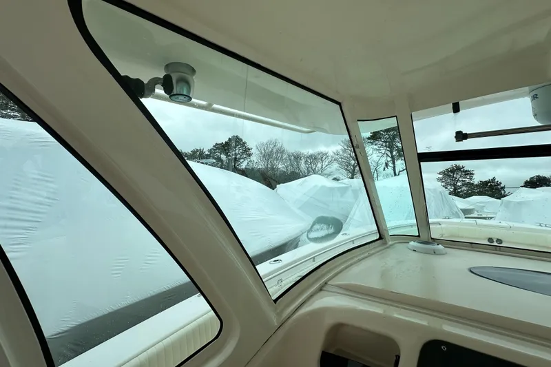 Slide: The Image of Interior view of 2011 Grady-White Canyon 366 boat, showcasing windows and outdoor scenery. - 19