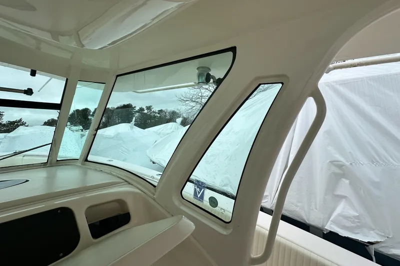 Slide: The Image of Interior view of 2011 Grady-White Canyon 366 boat with covered surroundings. - 21
