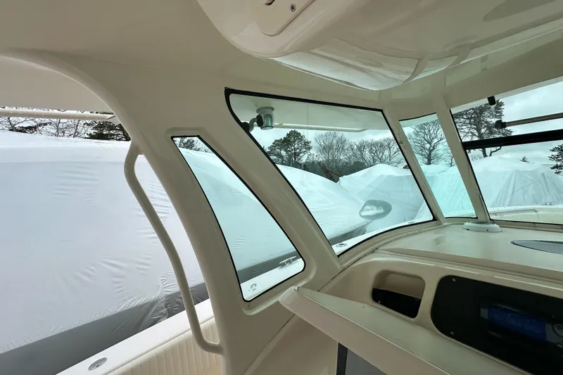 Slide: The Image of Interior view of 2011 Grady-White Canyon 366 boat, showcasing windows and dashboard. - 22