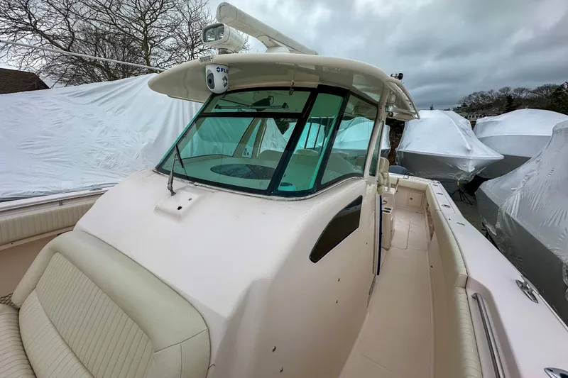 Slide: The Image of 2011 Grady-White Canyon 366 boat with covered vessels in the background. - 26