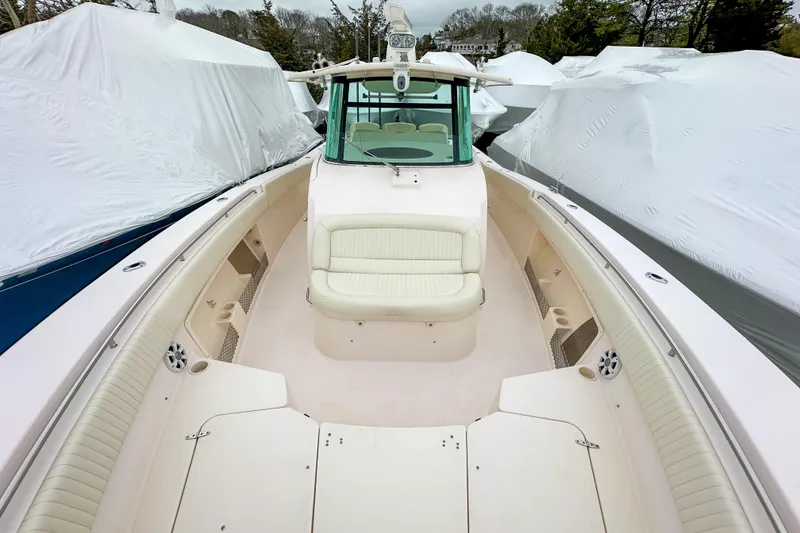 Slide: The Image of 2011 Grady-White Canyon 366 boat interior with cushioned seating and spacious deck. - 29