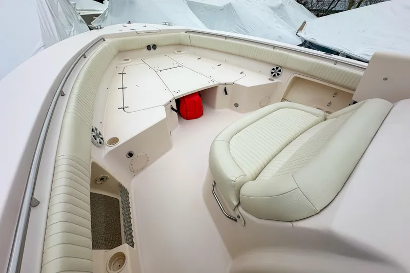 Slide: The Image of 2011 Grady-White Canyon 366 boat interior with cushioned seating and storage compartments. - 33