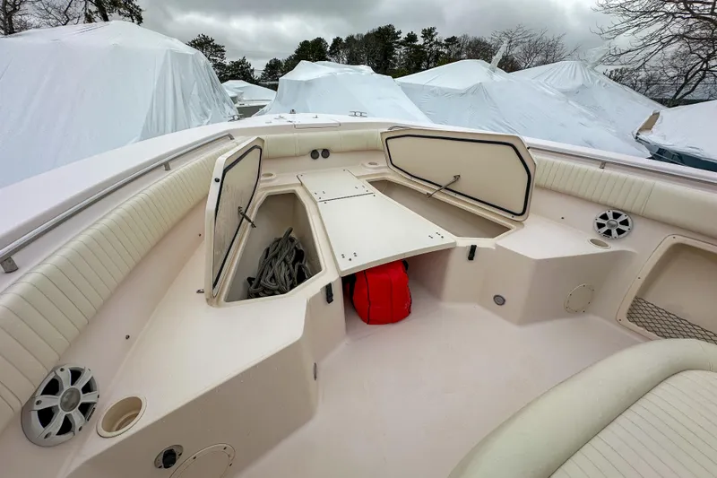 Slide: The Image of 2011 Grady-White Canyon 366 boat interior with open storage compartments and seating. - 36