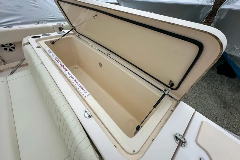 Slide: The Image of Open storage compartment on a 2011 Grady-White Canyon 366 boat, showcasing interior space. - 37