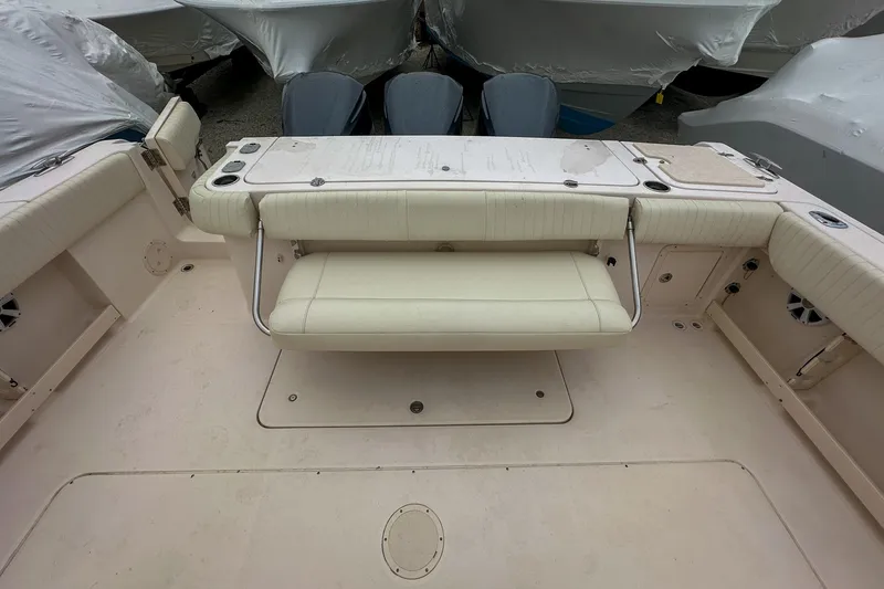 Slide: The Image of 2011 Grady-White Canyon 366 boat interior with cushioned seating and storage compartments. - 38