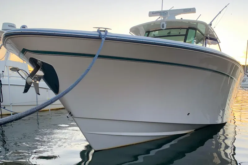 Slide: The Image of 2011 Grady-White Canyon 366 boat docked at sunset, front view. - 4