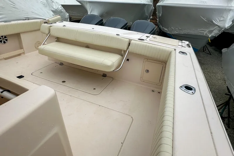 Slide: The Image of 2011 Grady-White Canyon 366 boat deck with cushioned seating and storage compartments. - 43