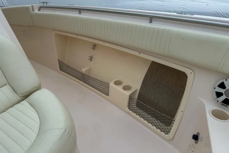 Slide: The Image of 2011 Grady-White Canyon 366 boat interior with seating, storage, and cup holders. - 45