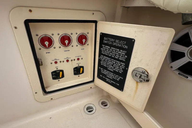 Slide: The Image of Control panel on a 2011 Grady-White Canyon 366 boat, featuring battery select switches. - 47