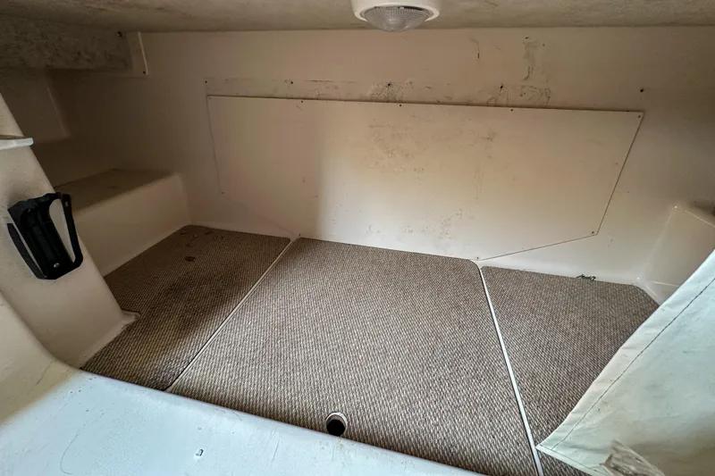 Slide: The Image of Interior cabin of 2011 Grady-White Canyon 366 boat, featuring carpeted flooring. - 49