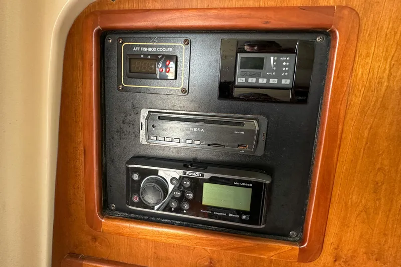 Slide: The Image of Control panel on 2011 Grady-White Canyon 366 boat with electronic devices. - 56