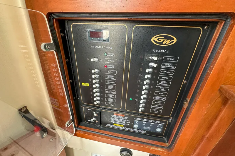 Slide: The Image of Electrical control panel on a 2011 Grady-White Canyon 366 boat. - 57