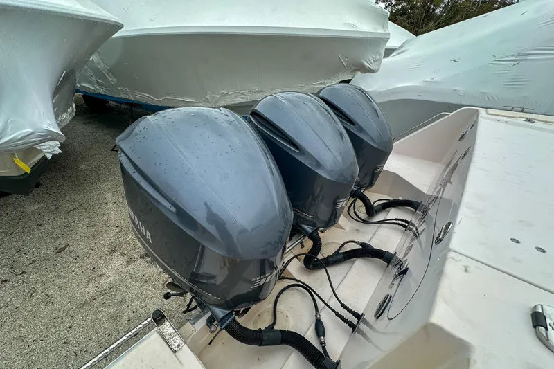 Slide: The Image of Triple Yamaha outboard engines on a 2011 Grady-White Canyon 366 boat. - 59