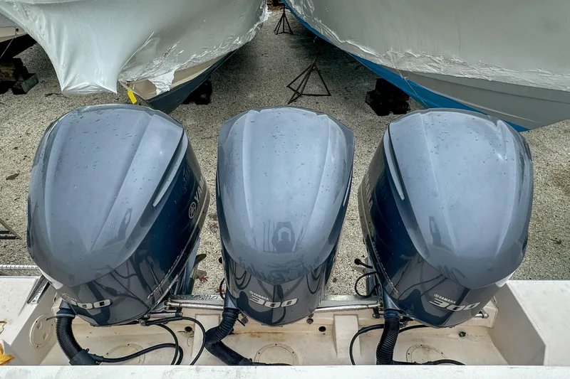 Slide: The Image of Three Yamaha 300 outboard engines on a 2011 Grady-White Canyon 366 boat. - 60