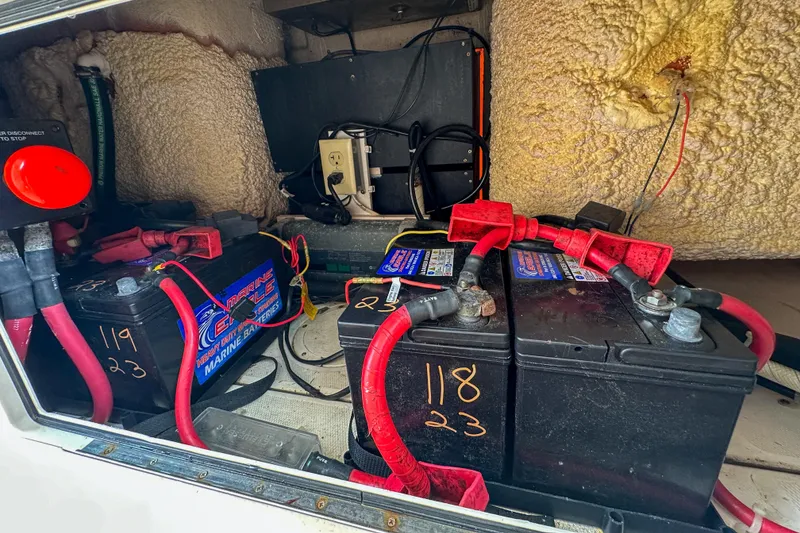 Slide: The Image of Marine battery compartment of 2011 Grady-White Canyon 366 boat with wiring and insulation. - 63