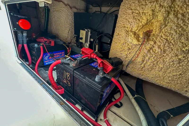 Slide: The Image of Battery compartment of a 2011 Grady-White Canyon 366 boat with marine wiring. - 64