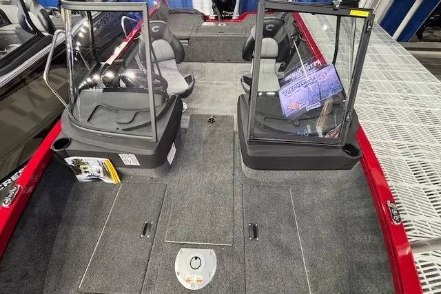 Slide: The Image of 2026 Crestliner 1750 Bass Hawk interior with dual seats and windshield, featuring spacious deck layout. - 10