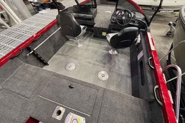 Slide: The Image of 2026 Crestliner 1750 Bass Hawk interior with dual seats and steering console. - 19