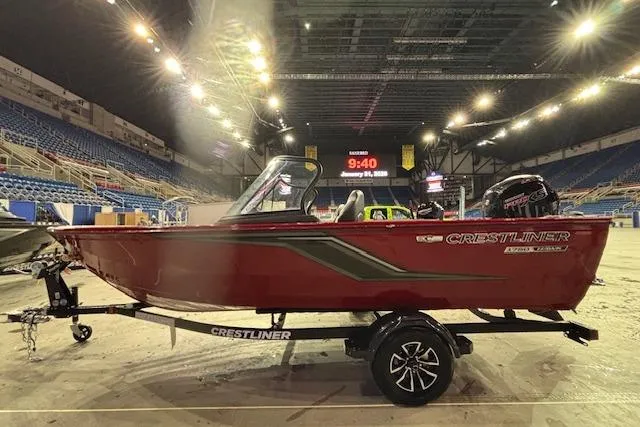 Slide: The Image of 2026 Crestliner 1750 Bass Hawk boat displayed indoors on a trailer. - 3