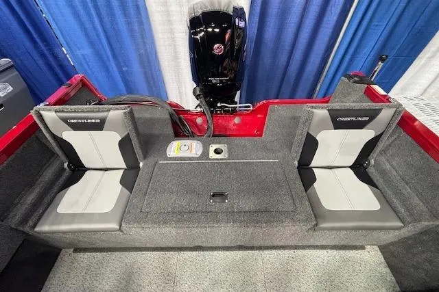 Slide: The Image of 2026 Crestliner 1750 Bass Hawk boat interior with dual seats and motor, showcased at an event. - 6