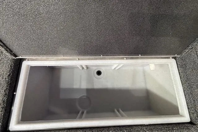 Slide: The Image of 2026 Crestliner 1750 Bass Hawk livewell, open and empty, showcasing interior design. - 7