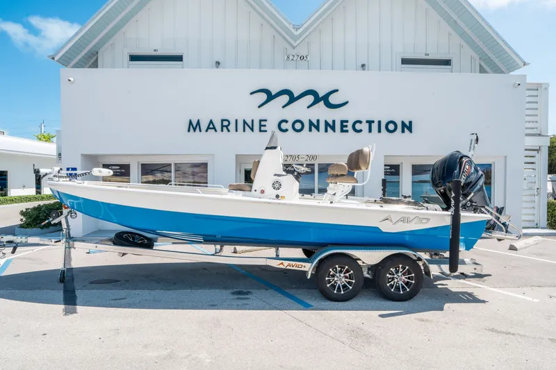 The Image of 2026 Avid 23 Fusion boat in front of Marine Connection building. - 1