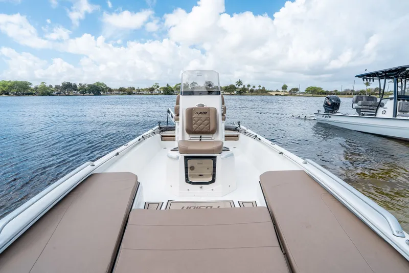 Slide: The Image of Avid 23 Fusion 2026 boat on calm water with blue sky. - 18