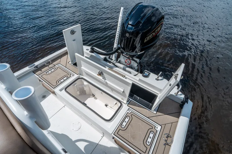 Slide: The Image of Avid 23 Fusion 2026 boat with open storage and motor. - 9