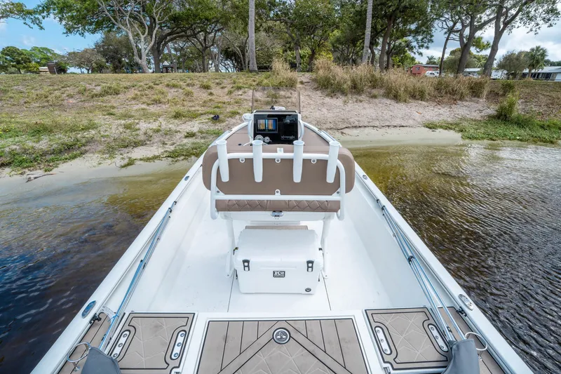 Slide: The Image of Avid 23 Fusion 2026 boat docked at a lakeside. - 5